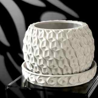 High-detail 3D-printed white ceramic vase with textured geometric pattern.