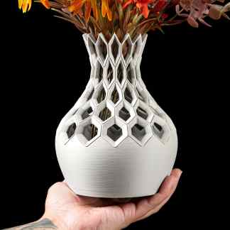 3D printed vase with geometric hexagon pattern, showcasing advanced design and craftsmanship.