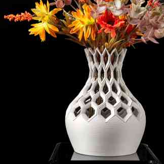Decorative 3D-printed vase with artificial colorful flowers for modern home or office decor.