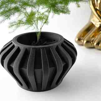 A sleek black 3D-printed vase with detailed design, perfect for contemporary decor.
