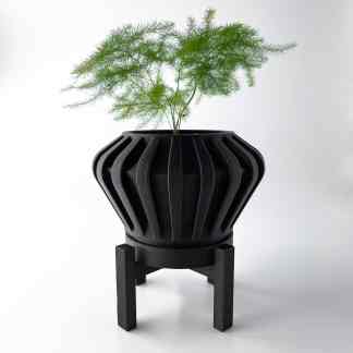 Alt text: Black 3D printed plant pot stand with a leafy green plant on a white background.