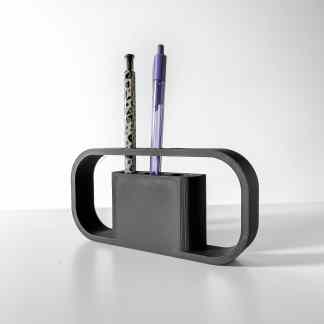 3D-printed pen holder with sleek black frame and slots for pens, ideal for desktop organization and office decor.