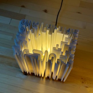 LED maze lamp with 3D printed structure, warm glow, creative lighting decor for living or office spaces.