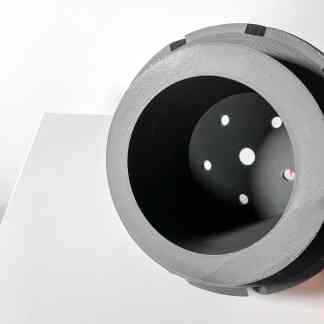 High-quality 3D printed metal component with precision holes and a sleek finish.