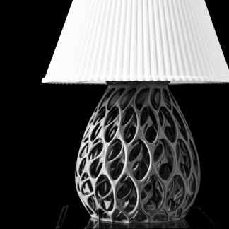 High-resolution 3D printed table lamp with a unique, open lattice base and sleek white lampshade.
