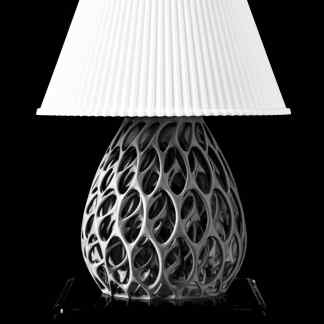 High-quality 3D-printed ceramic table lamp with detailed lattice design and white fabric shade.