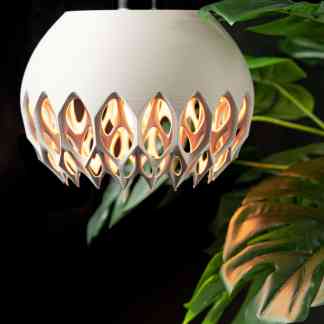 3D printed decorative lamp with intricate design and warm lighting, perfect for modern interiors and decor.