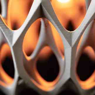 Close-up of a 3D-printed geometric pattern showcasing detailed craftsmanship and modern design elements.