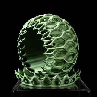 Intricate green 3D-printed geometric sphere with lattice structure on display.