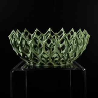 High-quality 3D printed geometric bowl on transparent display stand.