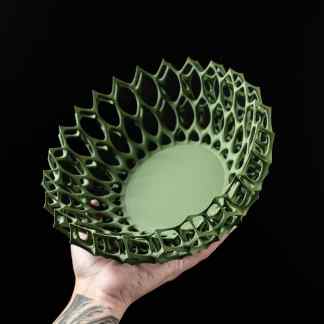 Unique green 3D-printed decorative vase with intricate lattice design.