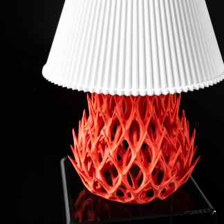 3D printed lamp with detailed red geometric base and white pleated shade, showcasing innovative 3D printing design.