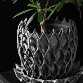 High-quality black 3D-printed plant pot with detailed lattice pattern for modern decor.