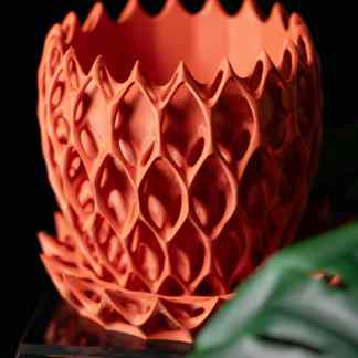 High-resolution image of a modern, intricately designed 3D printed ceramic vase showcasing innovative 3D printing technology.