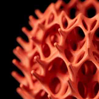 Detailed close-up of vibrant 3D printed coral showing intricate design and texture.