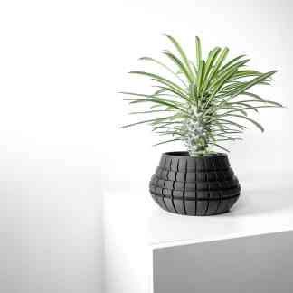 Stylish 3D printed black plant pot with structured geometric pattern for modern decor.
