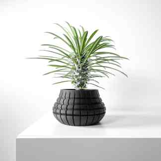 Stylish black 3D-printed plant pot in geometric design, perfect for modern home decor and showcasing 3D printing capabilities.