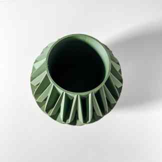 Highly detailed green turbine blade model made with 3D printing technology.