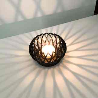 Light fixture showcasing innovative 3D printing technology, creating stunning shadow effects.