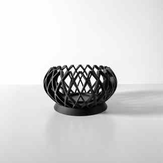 Black 3D printed lattice bowl showcasing advanced additive manufacturing.