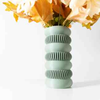 Bright green 3D printed vase showcasing innovative design for modern interior decoration.
