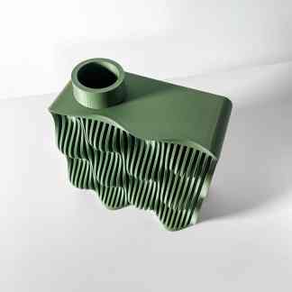 Detailed 3D printed green object with intricate design and textures, showcasing advanced additive manufacturing techniques.