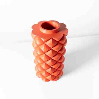 Vibrant orange 3D-printed pineapple-shaped vase with textured detailing, ideal for home decor and artistic design.