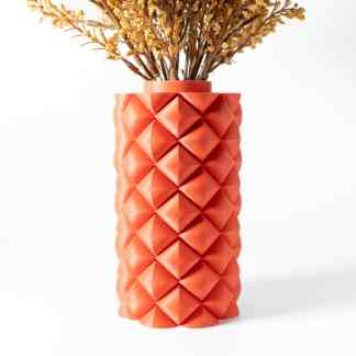 Bright decorative vase with 3D diamond pattern and dried botanical arrangement.