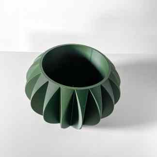 Highly detailed 3D-printed green turbine component with aerodynamic blades, showcasing precision manufacturing.