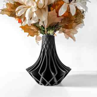 Black 3D-printed geometric vase with intricate patterns for contemporary home decor.