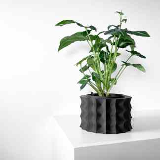 3D printed modern plant pot with sleek black design for stylish home decor.