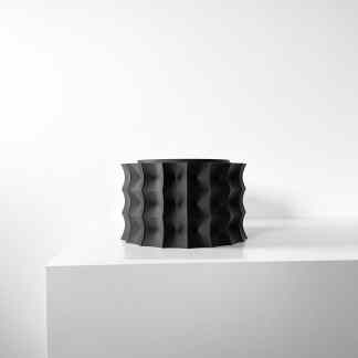 Black 3D-printed sculptural vase with an elegant wavy pattern, perfect for modern interior design accents.