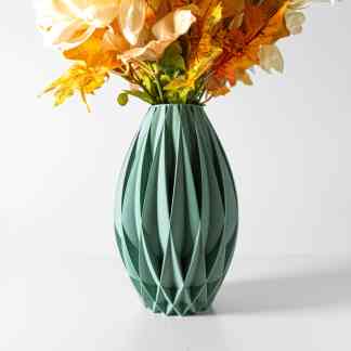Elegance in 3D printing: green textured vase holding vibrant artificial flowers for stylish interior design.