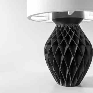 Stylish black 3D-printed vase with intricate geometric design, highlighting innovative 3D printing technology.