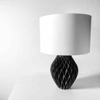 3D-printed black geometric table lamp with white shade, stylish home decor.