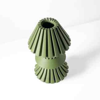 Highly detailed green 3D printed fan blade for electronics or cooling applications.