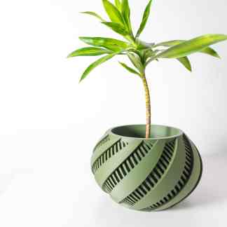 Sleek green 3D-printed planter holding a healthy indoor plant, showcasing innovative design.