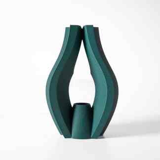 Modern geometric 3D printed sculpture in teal with intricate details.
