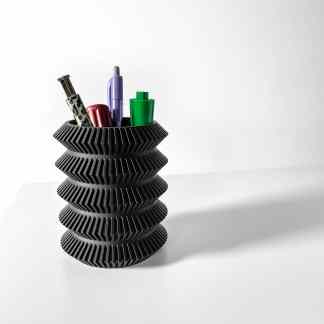 High-quality 3D printed pen holder featuring bold black geometric rings, ideal for storing pens and stationery.