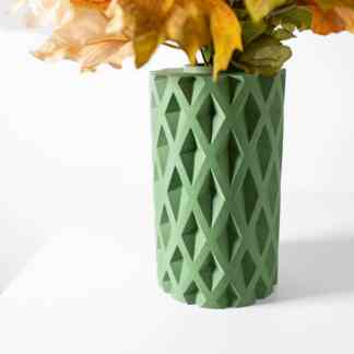 Vase with geometric 3D-printed pattern, modern green vase for home decor, stylish interior design accessory.