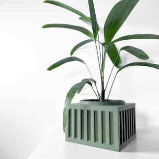 Stylish green plant in modern geometric pot, ideal for home or office interior decor.