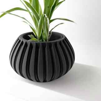 Black 3D-printed decorative planter with ribbed pattern, perfect for stylish interior or outdoor plant displays.