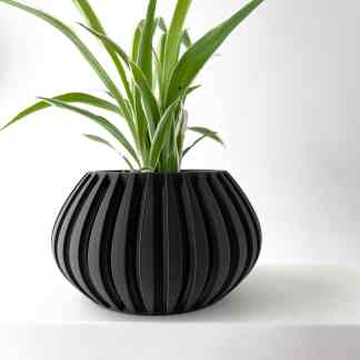 3D printed black vase with ribbed pattern for contemporary interior design.