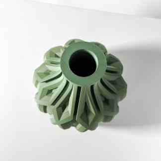 Close-up of a green 3D-printed decorative vase showing intricate geometric patterns, created by AM Square 3D.