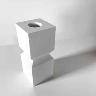 Minimalist 3D printed white cube with a circular opening, exemplifying advanced additive manufacturing.