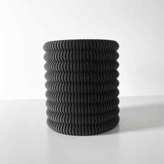 Sleek black 3D printed vase featuring detailed ribbed texture, ideal for contemporary interior decoration.