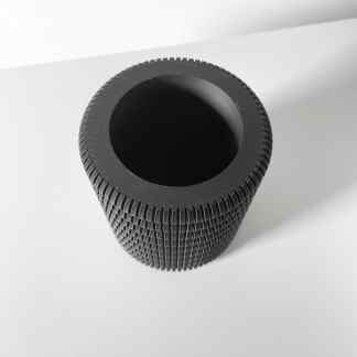 High-resolution 3D printed black roller with textured surface, ideal for industrial use.
