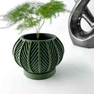 Detailed 3D-printed green vase with leaf-like patterns, highlighting advanced additive manufacturing techniques.
