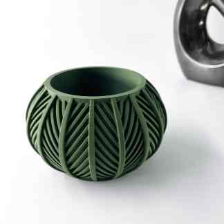 High-resolution image of a green 3D printed decorative vase showcasing detailed leaf-inspired patterns.