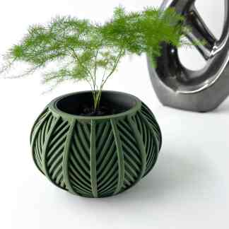 Vase with detailed leaf pattern, perfect for contemporary interior decor and plant arrangements.